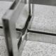 Coffee table with steel base and smoked glass slab. Circa 197
