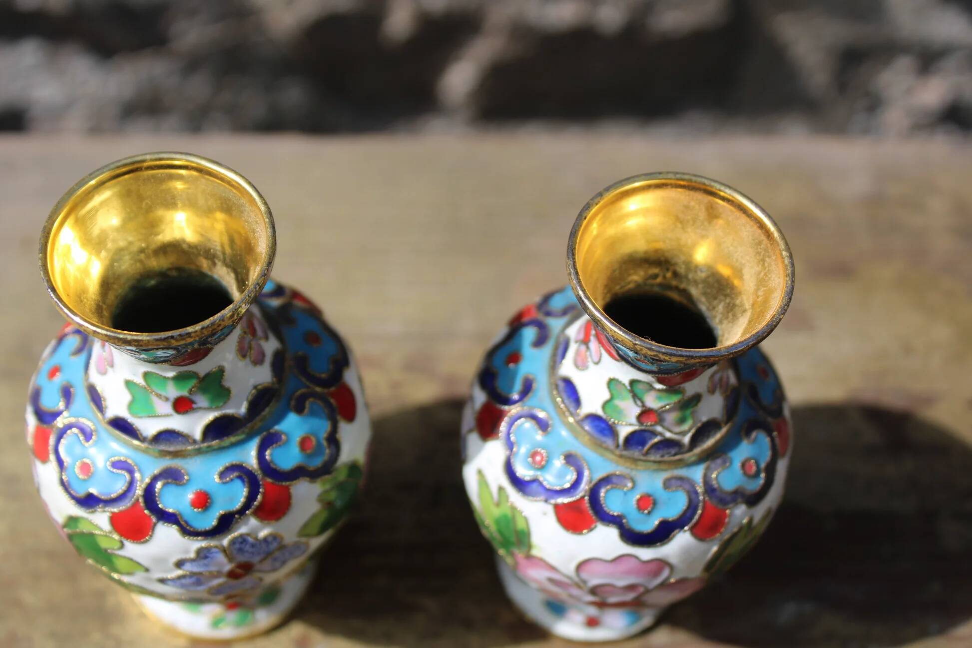 Two small vintage cloisonné enamel vases with Asian floral decoration.