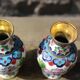 Two small vintage cloisonné enamel vases with Asian floral decoration.