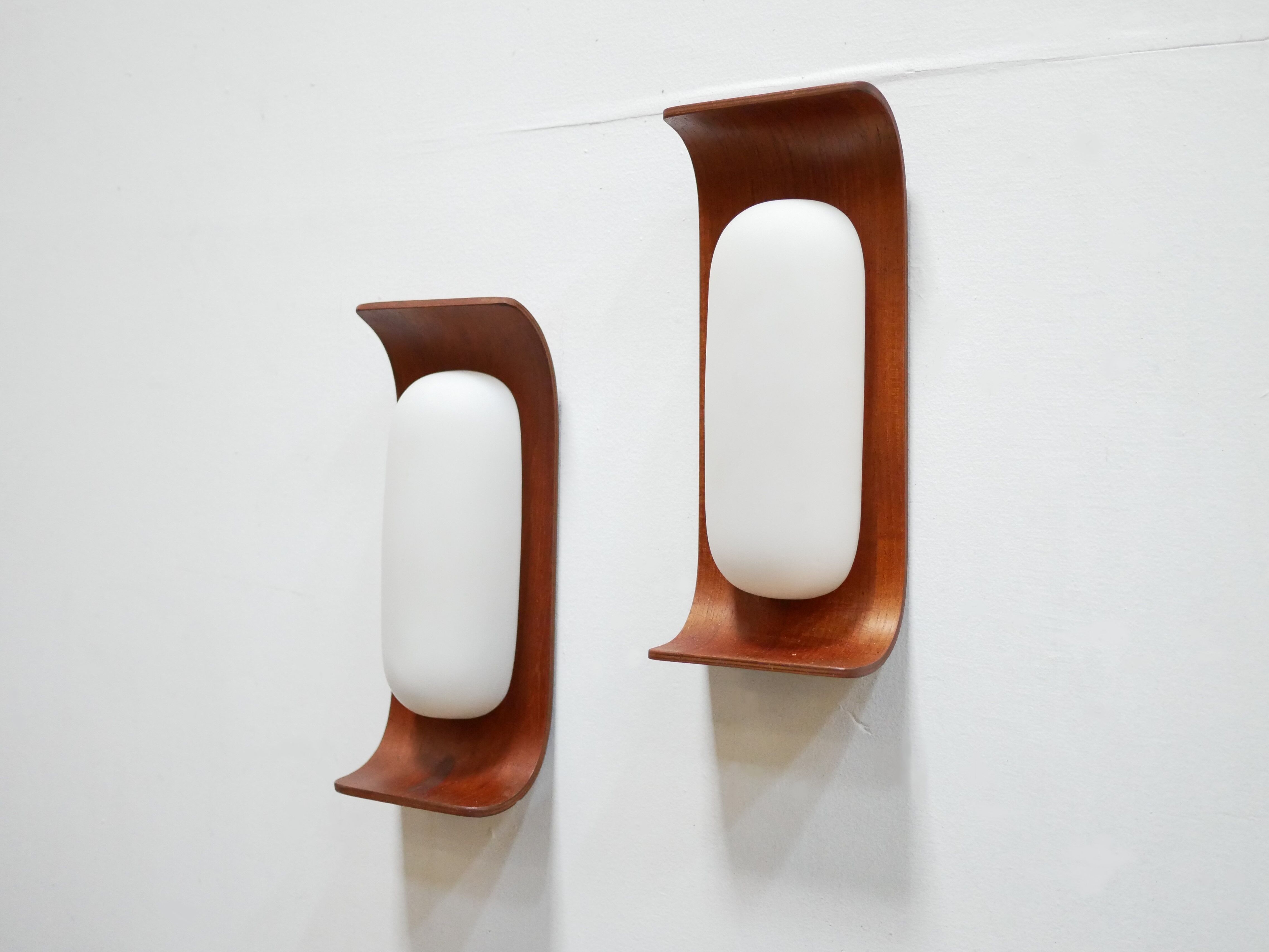 Pair of teak and opaline wall lamps by Goffredo Reggiani