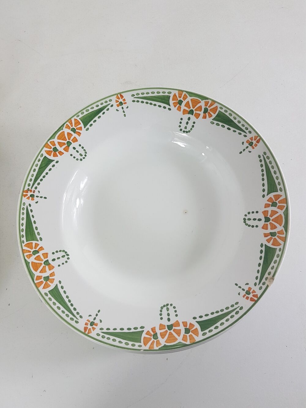 12 hollow plates made of Longwy earthenware