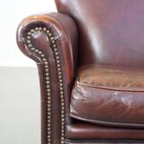 Sheep leather armchair correctly finished with decorative nails