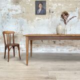 Vintage farm table with spindle legs.