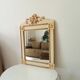 Vintage bohemian mirror from the 80s in carved wood.