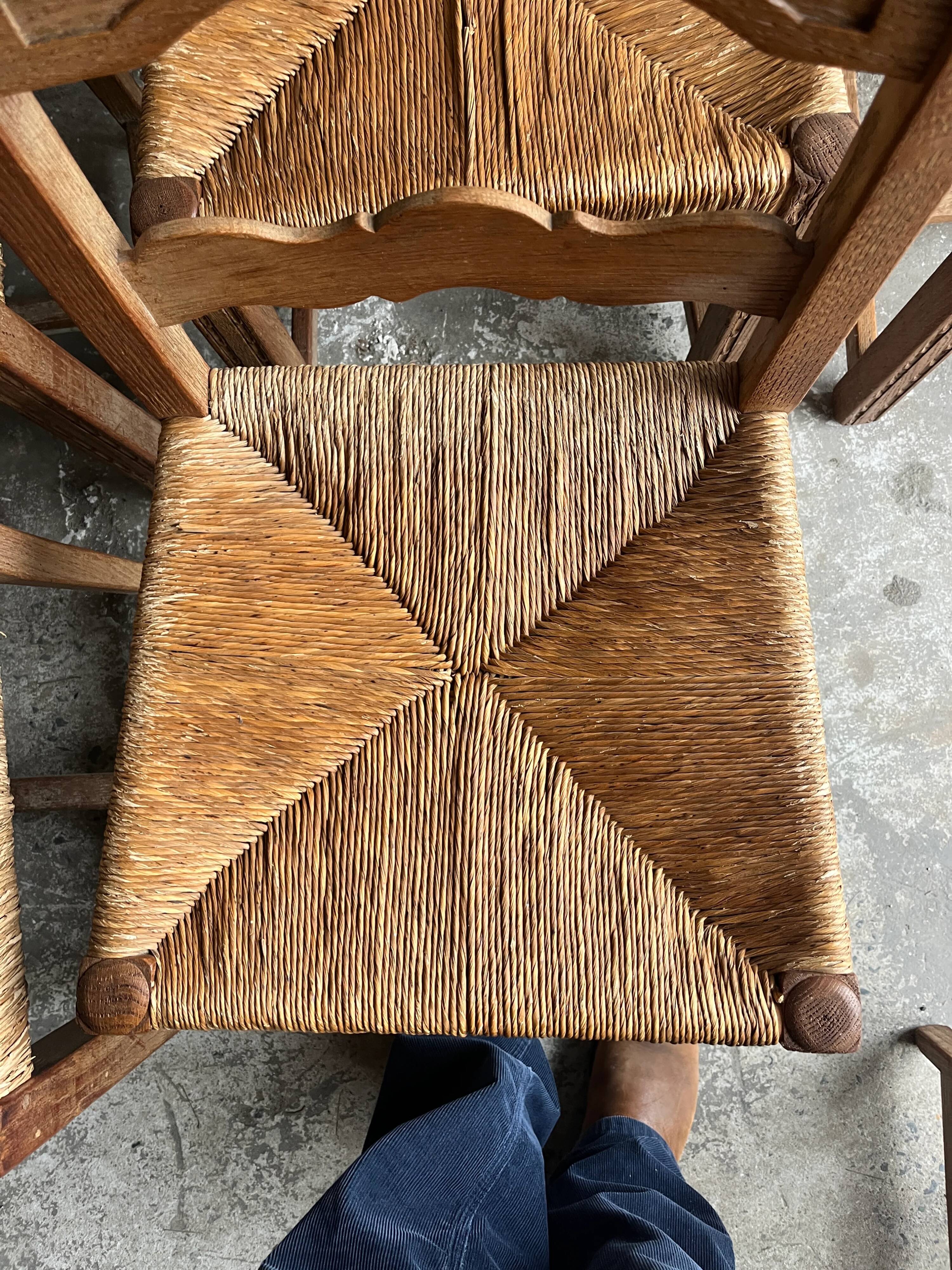 Set of 6 sculpted oak chairs with straw seats – 1950s