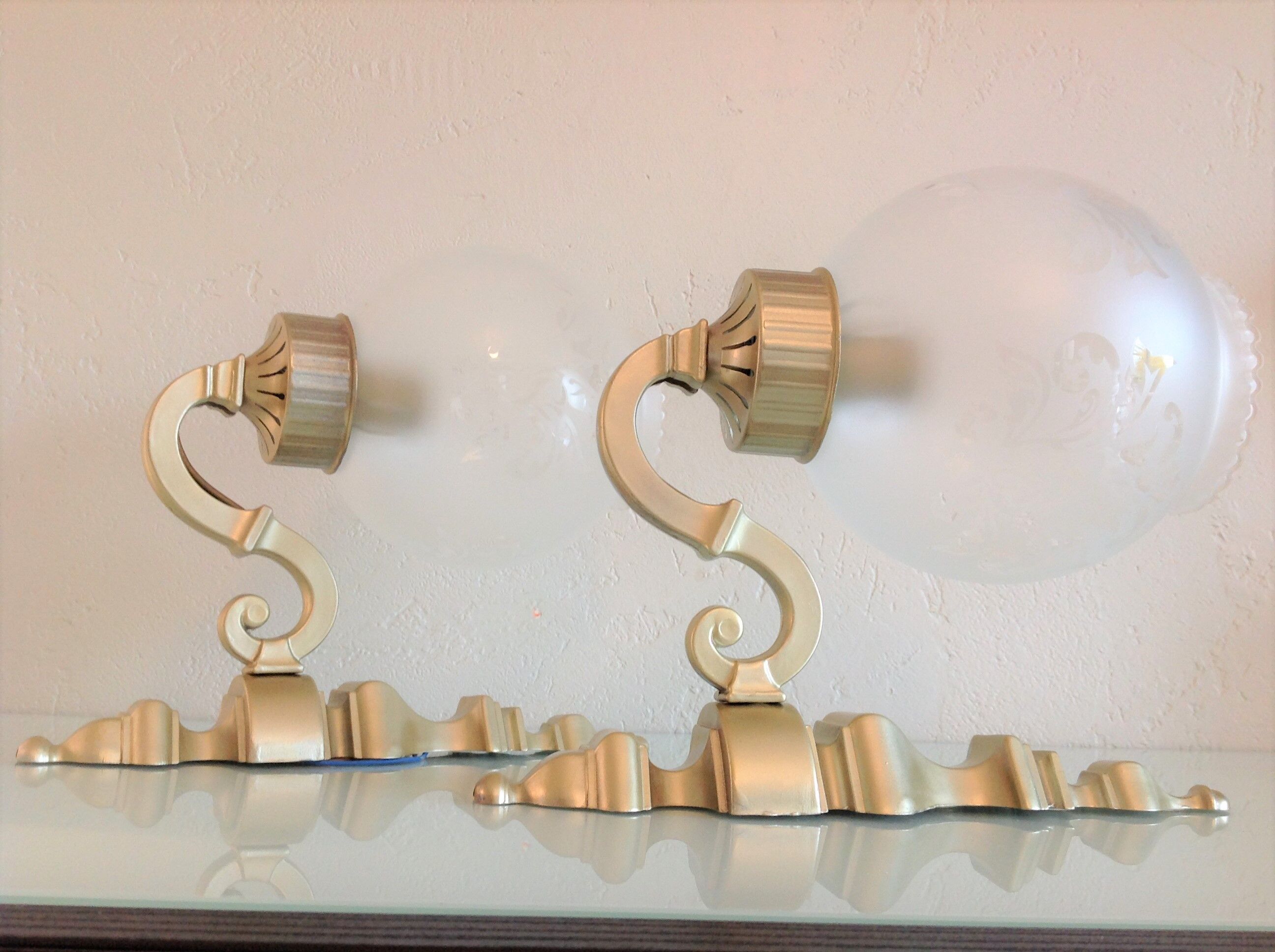 Pair of wall lamps in gilded metal and frosted glass art deco style