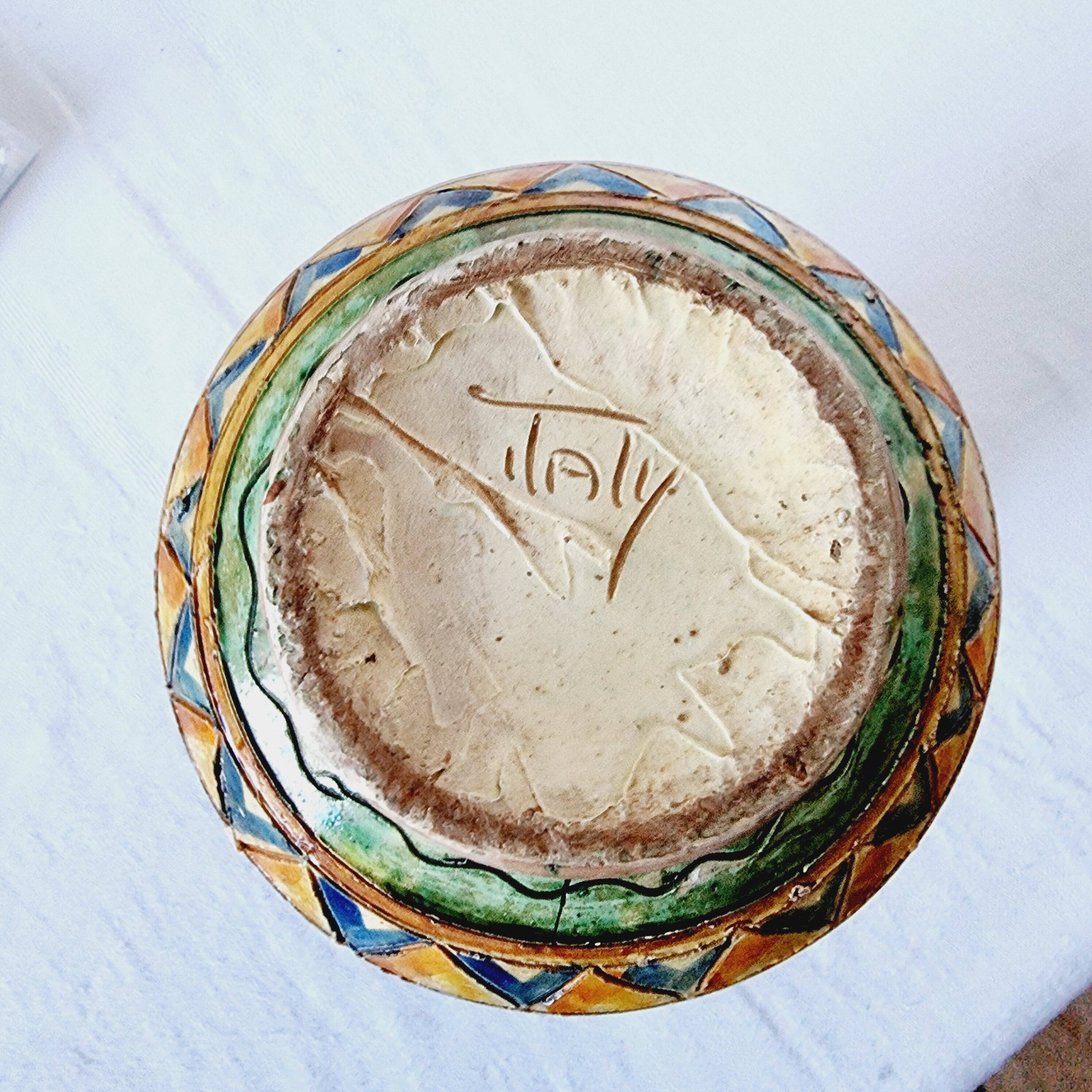 Antique majolica water pitcher made in Italy and hand painted.