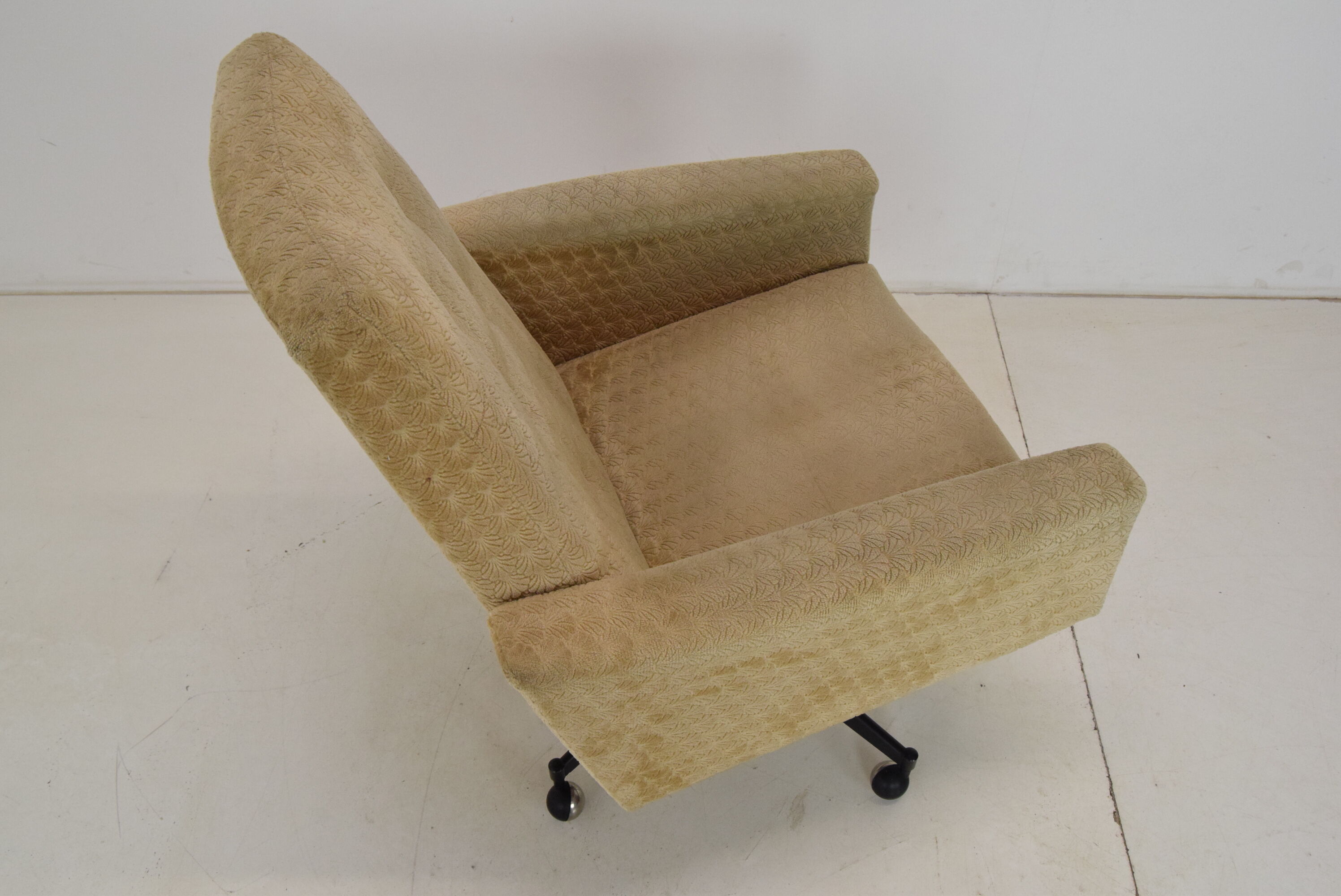 Mid-century swivel armchair with wheels 1970's
