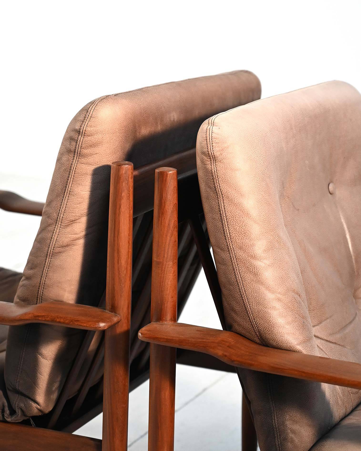 Scandinavian teak and leather lounge set with two armchairs and ottoman