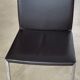 Brown leather chairs and Zanotta metal legs