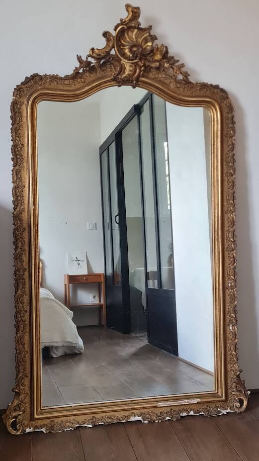 Antique Louis Philippe mirror with a pediment.