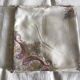 Grey silk nape and towels embroidered with coloured cashmere patterns