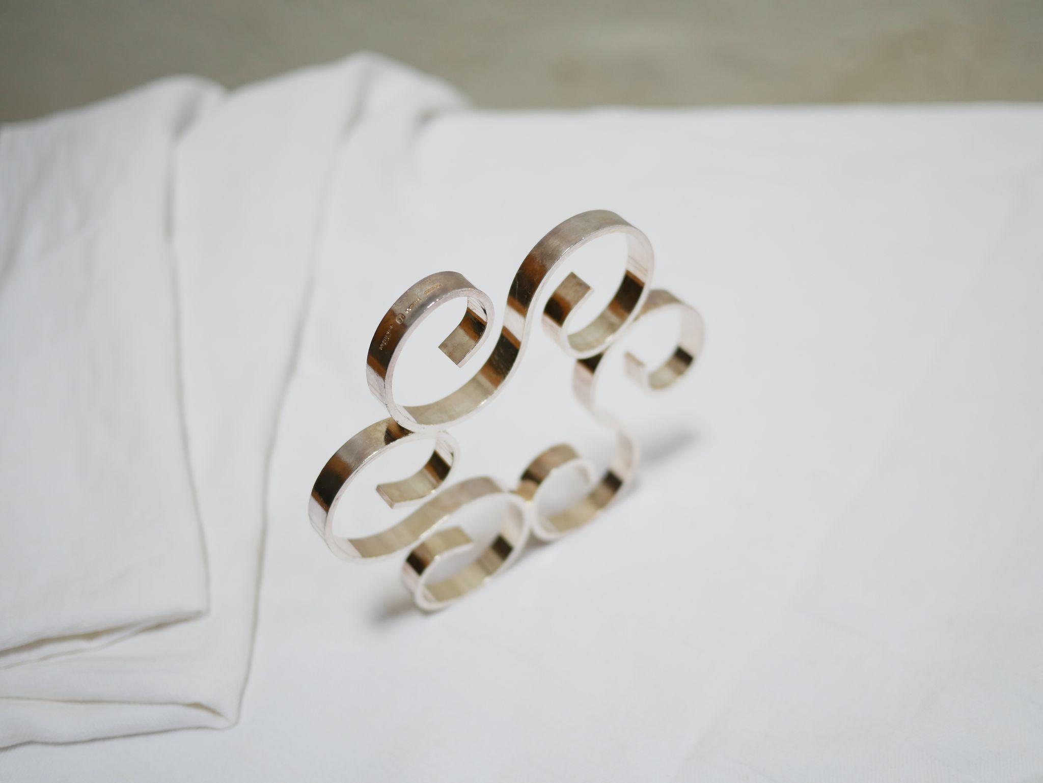 Silver metal underwear and bottles published by Christofle, Paris