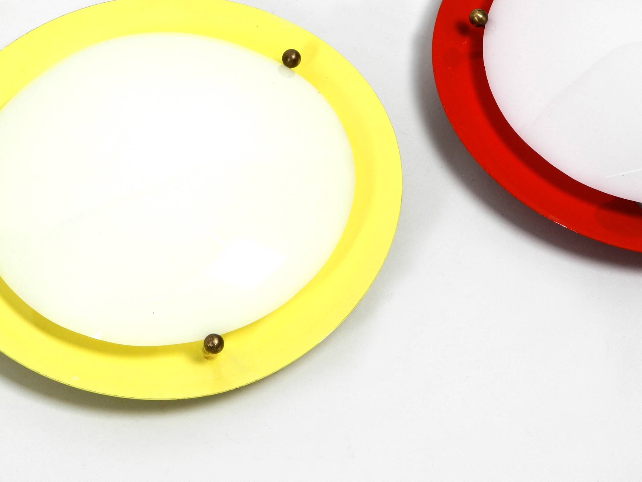 Three round 1950s wall or ceiling lamps made of metal and plexiglass shades