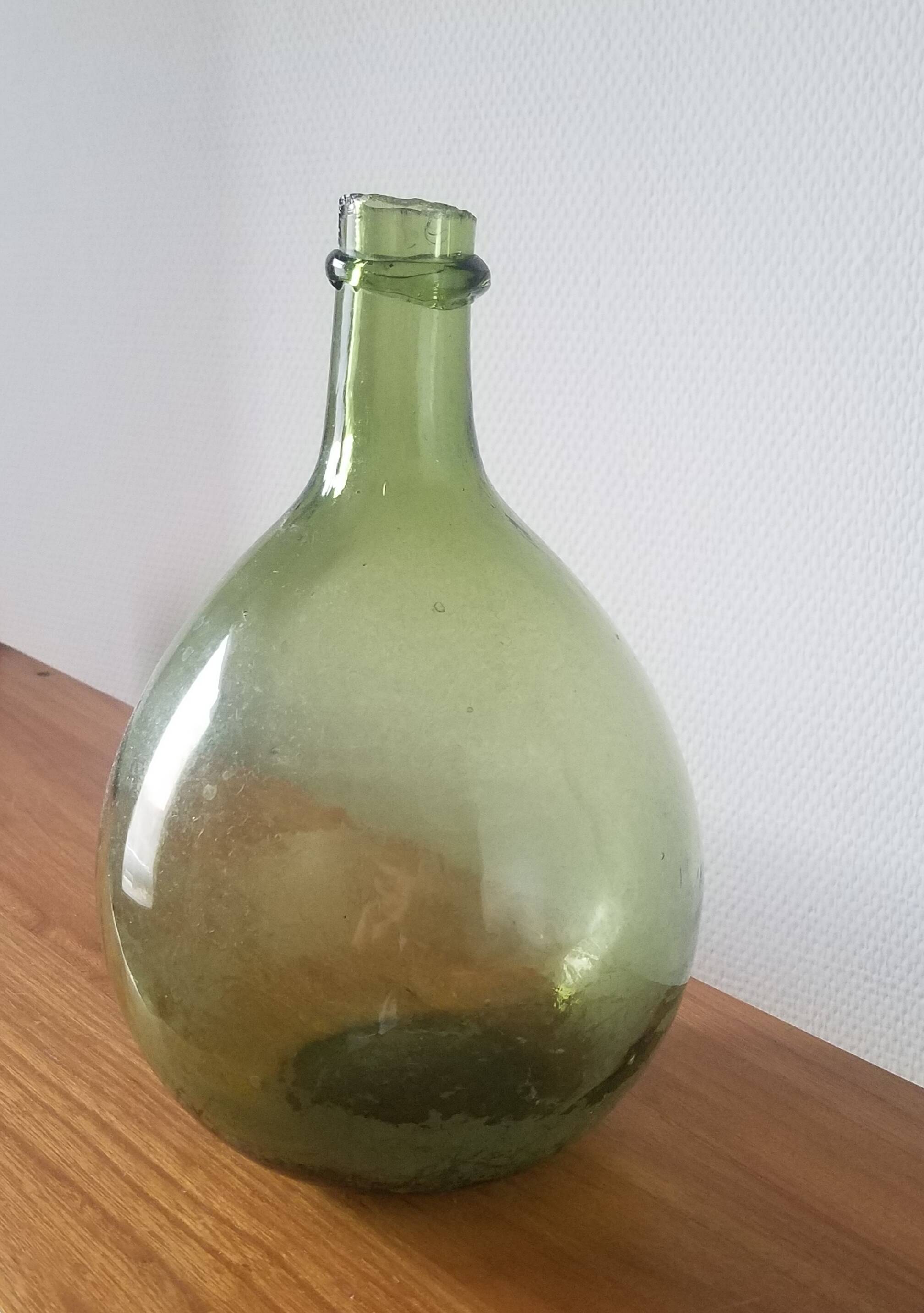 Vintage green demijohn