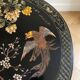 Asian coffee table in Chinese style made of black and gold lacquered wood.