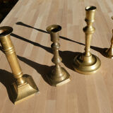 Set of 4 old candle holders in golden brass