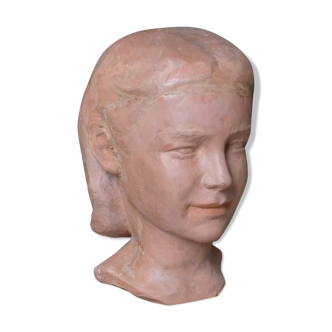 Head of a young woman in terracotta