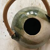 Handmade ceramic teapot with green fish and bamboo