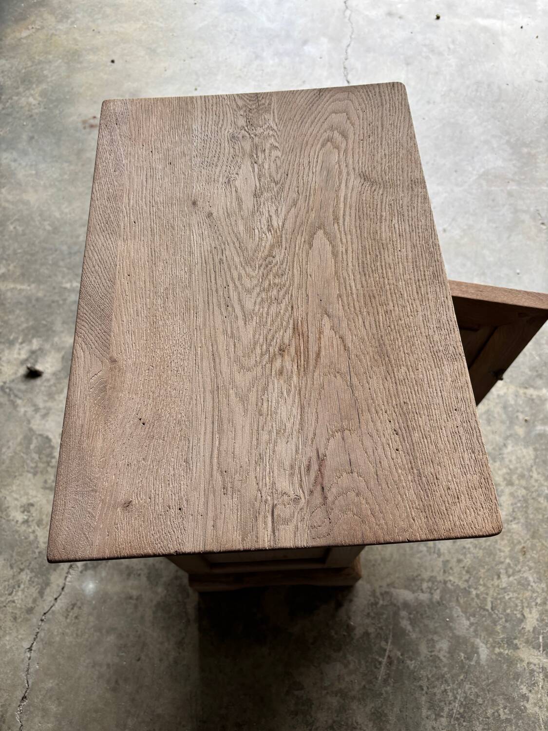 Raw wood bedside table