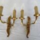 Pair of double wall lights in gilded bronze