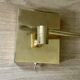 Pair of vintage brass wall lights with adjustable arms.