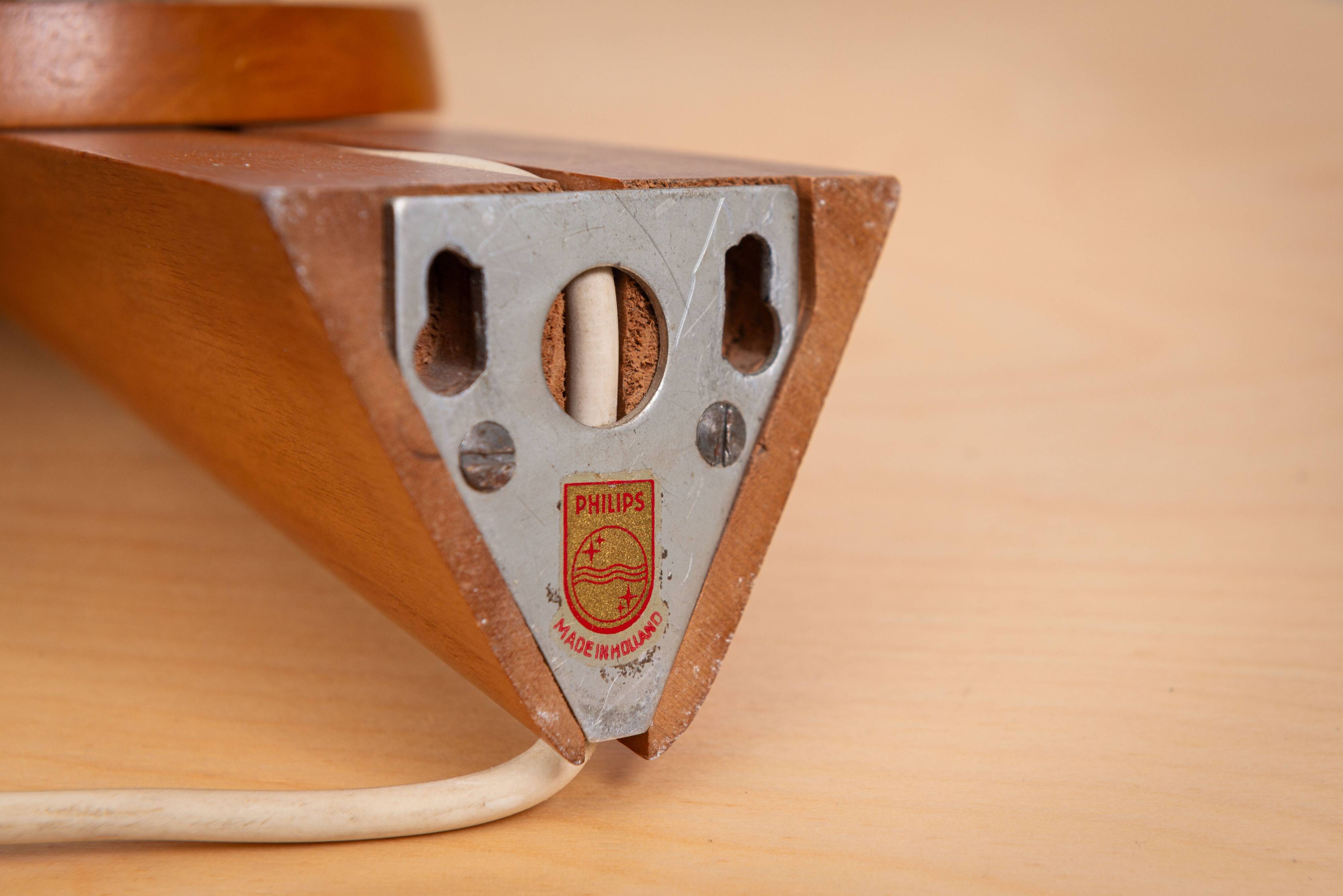 Wall lamp with opal glass shade on wooden base by Philips