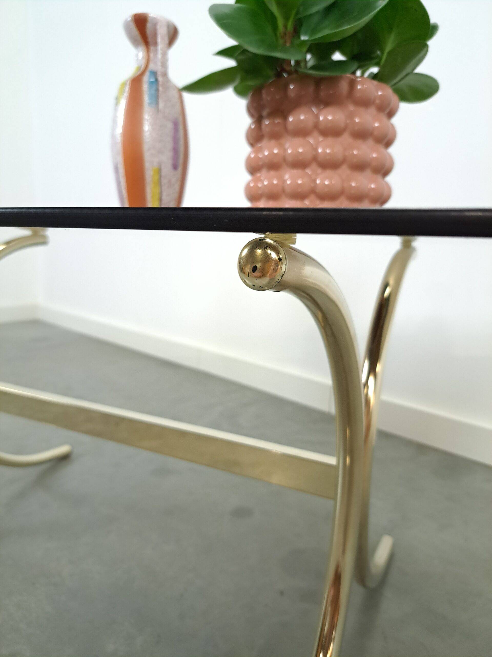 Smoked glass coffee table with gold-coloured legs from Sweden