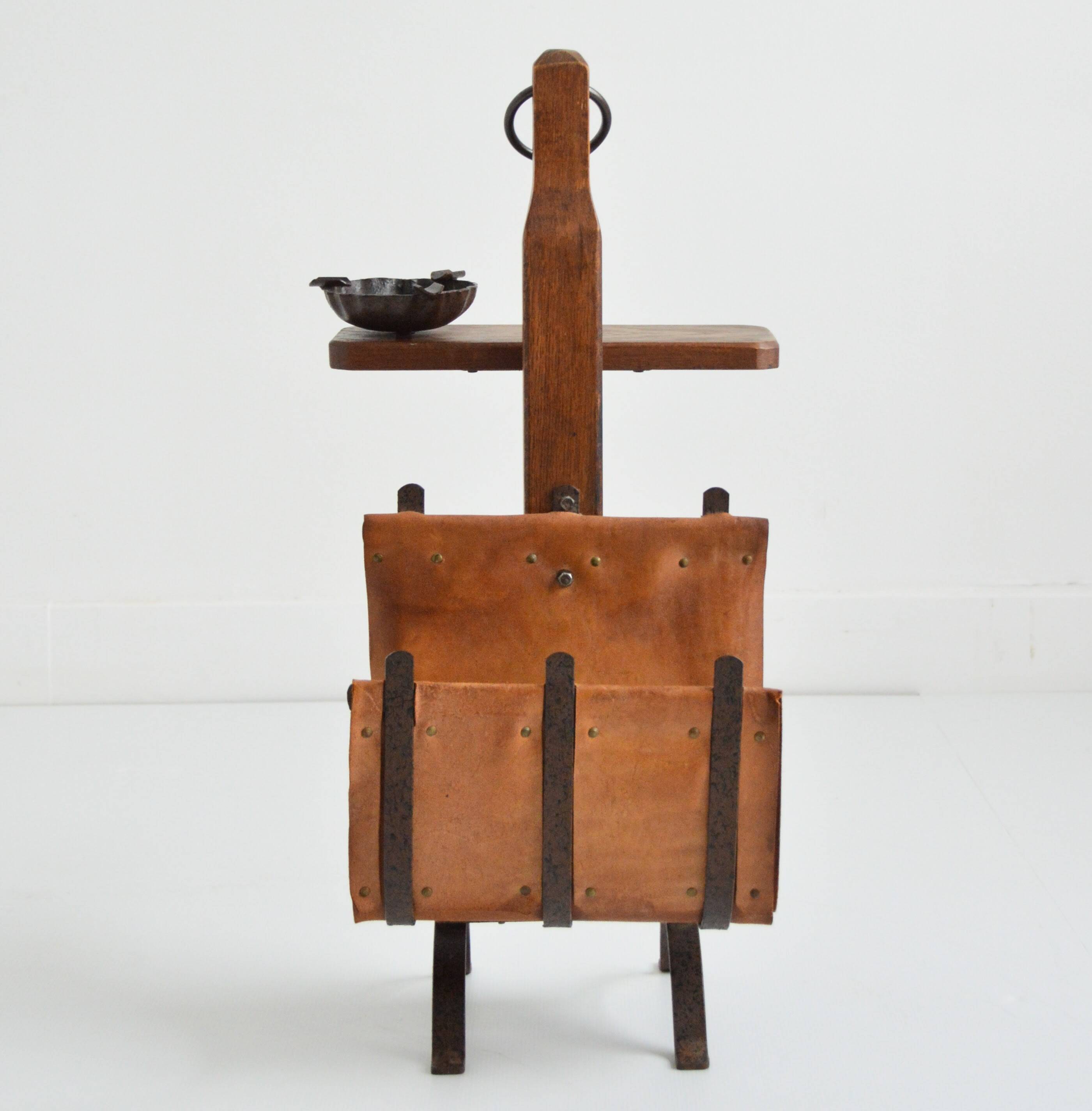 Vintage leather magazine rack with shelf and brutalist/rustic ashtray.