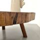 Brutalist coffee table in solid teak, monolithic slab, tripod base.