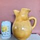 Large vintage artisanal glazed earthenware pitcher with pinched spout
