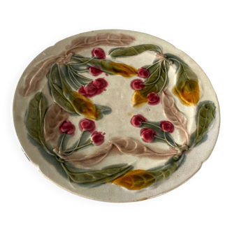 Old Barbotine plate decorated with cherries