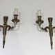 Pair of Louis XVI style wall sconces in bronze with an off-white patina