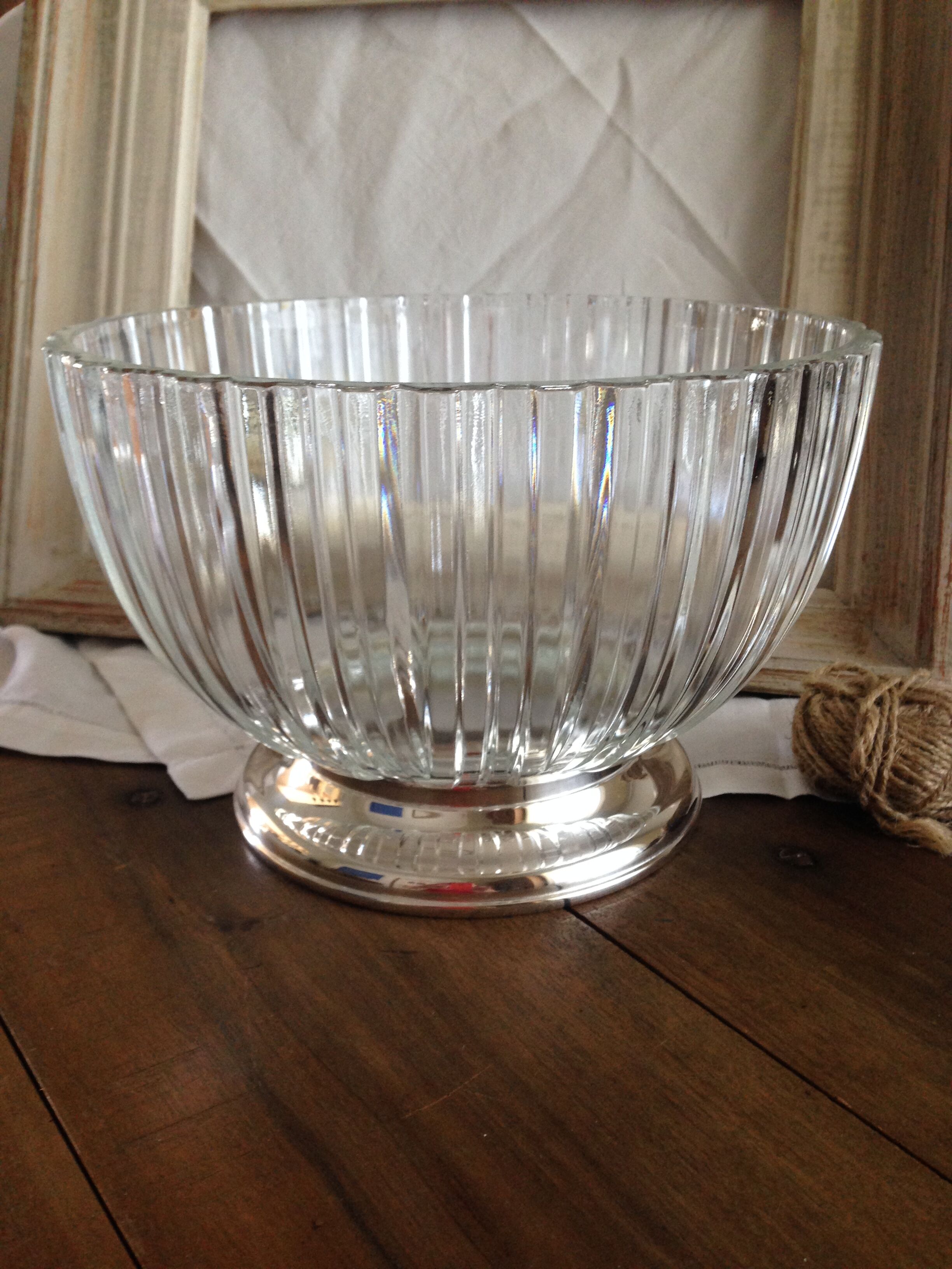 silver metal stand glass bowl