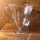 Old pitcher service and 5 foot glasses in engraved glass vintage table art