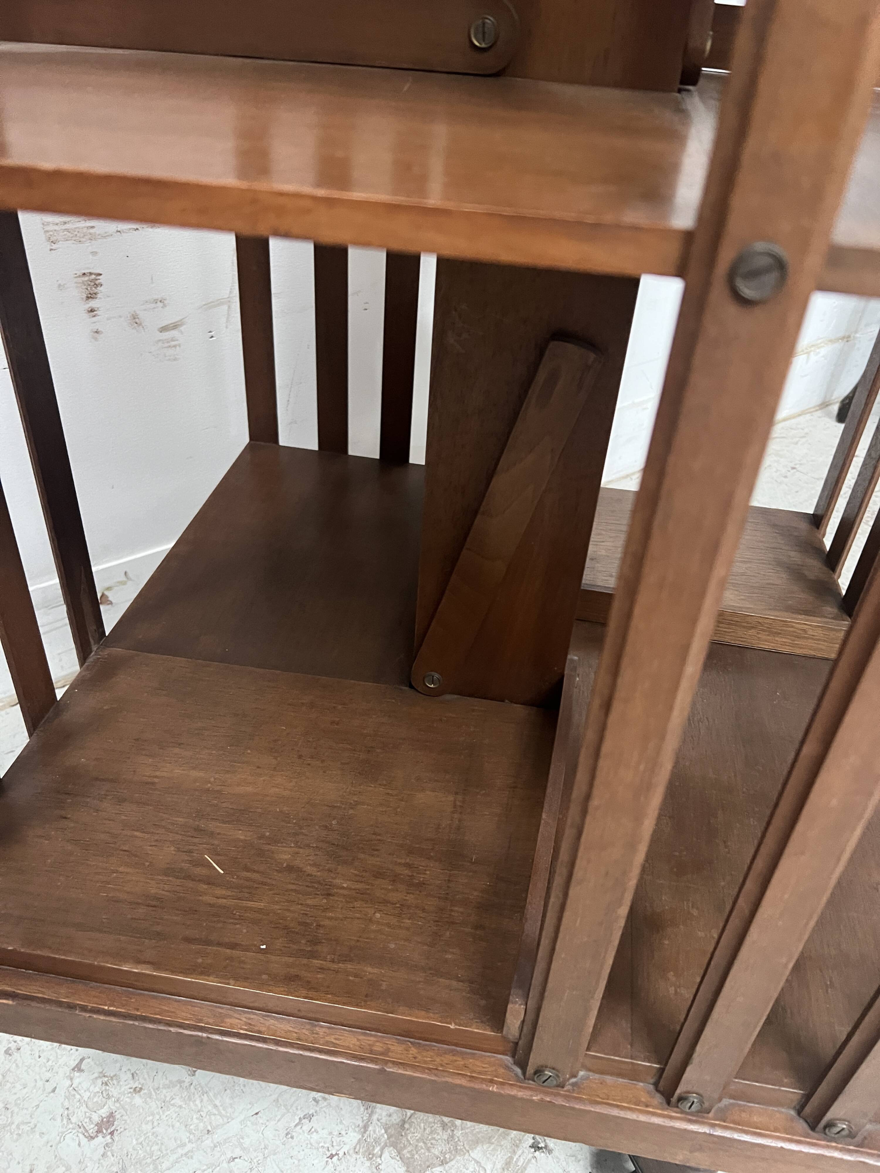 Rotating library in solid walnut, 20th century.