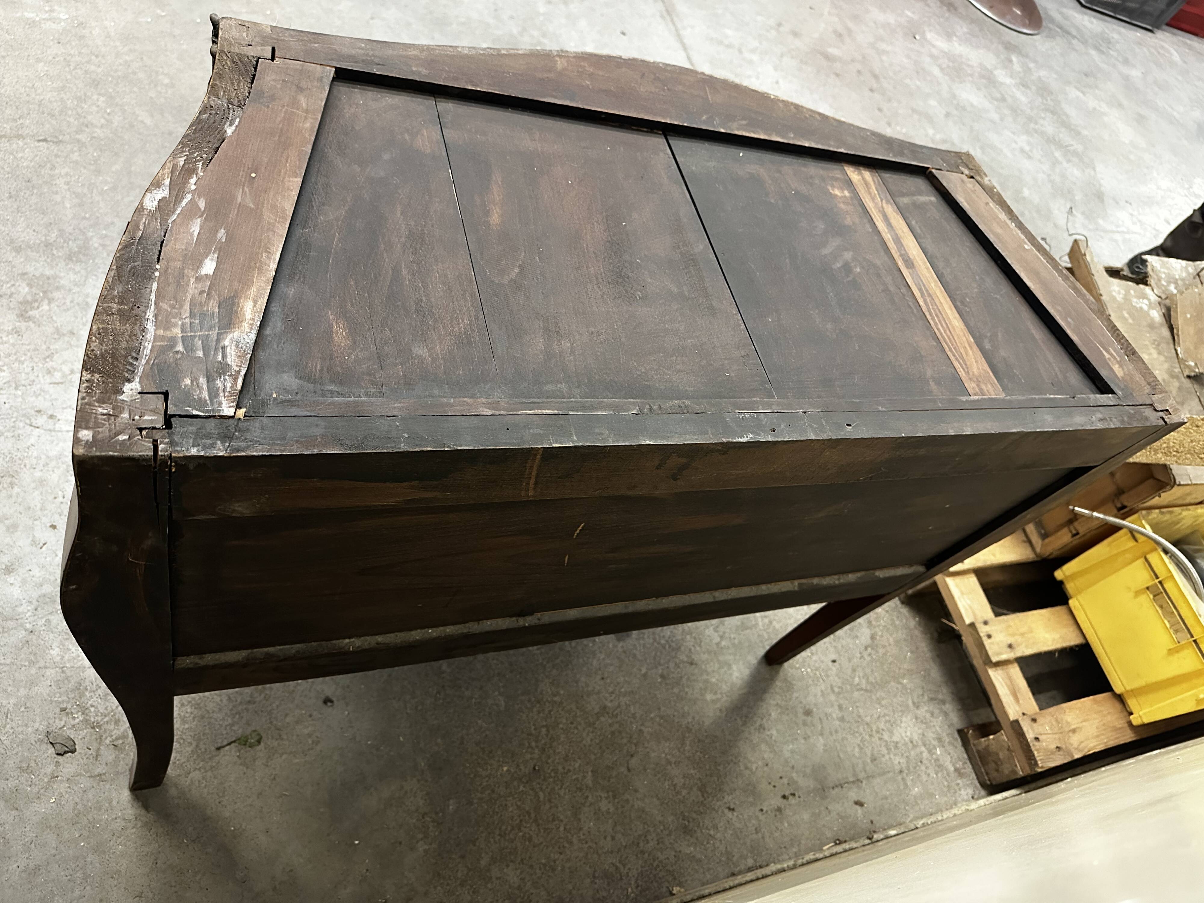 Curved and inlaid Louis XV style chest of drawers