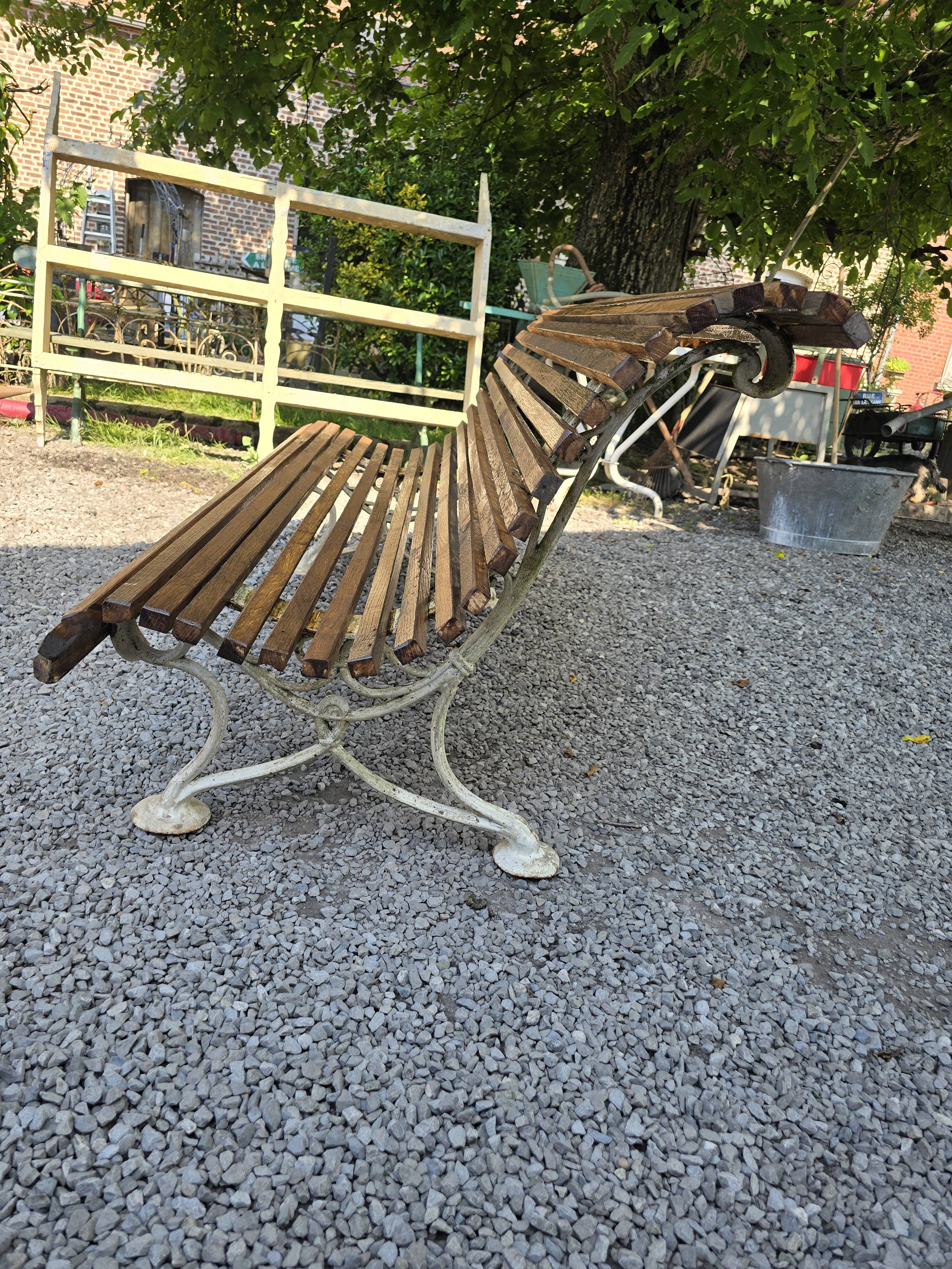 Garden bench with cast iron legs and oak slats