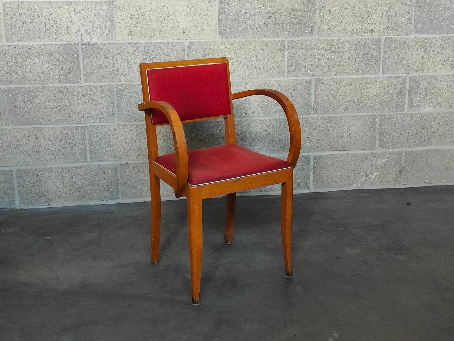 Small red bridge chair with armrests
