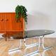 Oval coffee table in smoked glass and chrome, original double S design base, 1970.