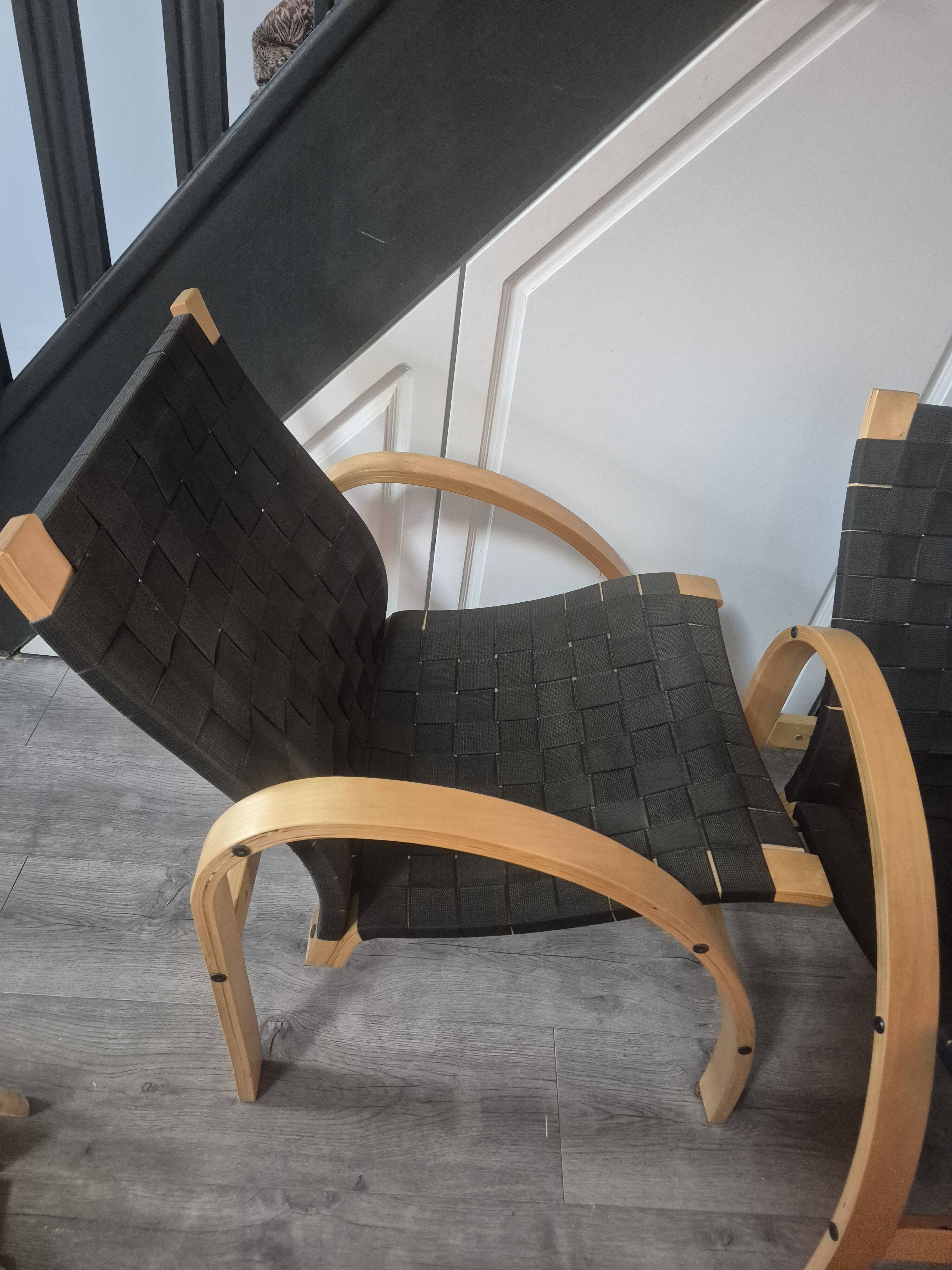 pair set of 2 armchairs with a wooden frame and black fabric weaving