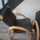 pair set of 2 armchairs with a wooden frame and black fabric weaving