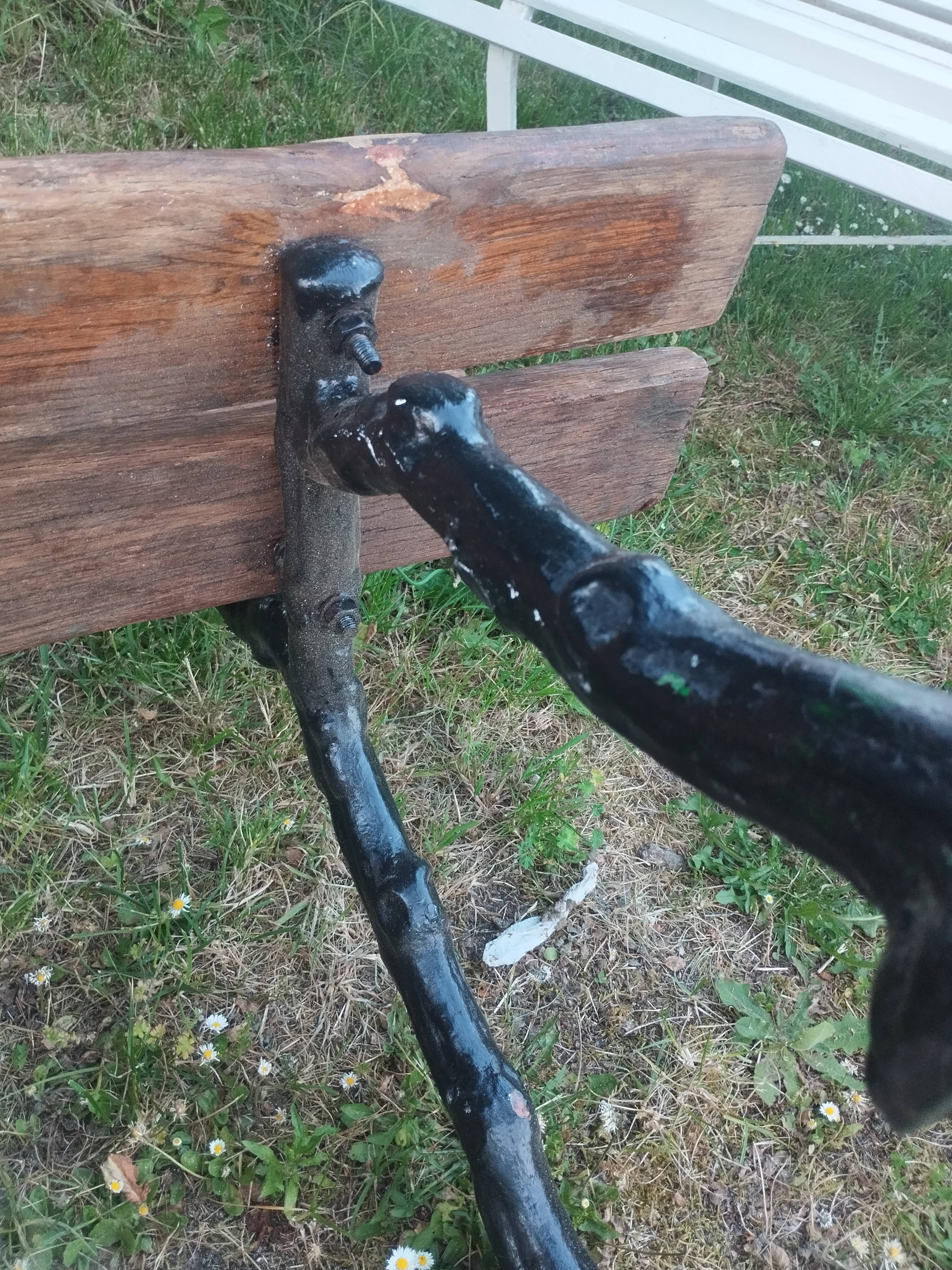 Antique garden bench with cast iron legs