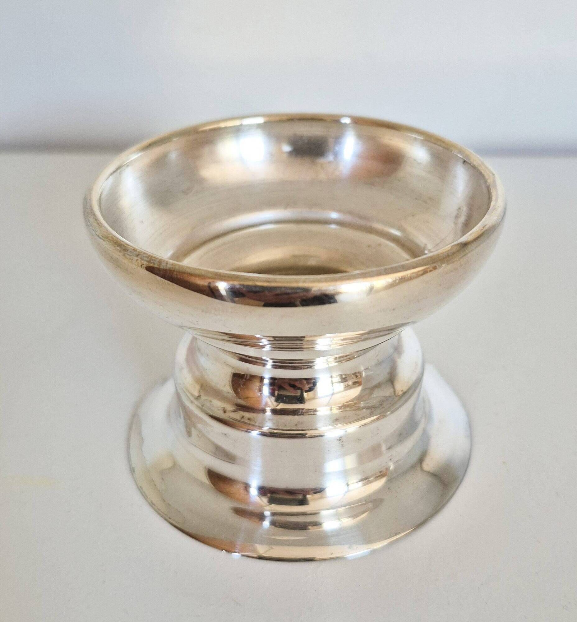 Antique silver candle holder.