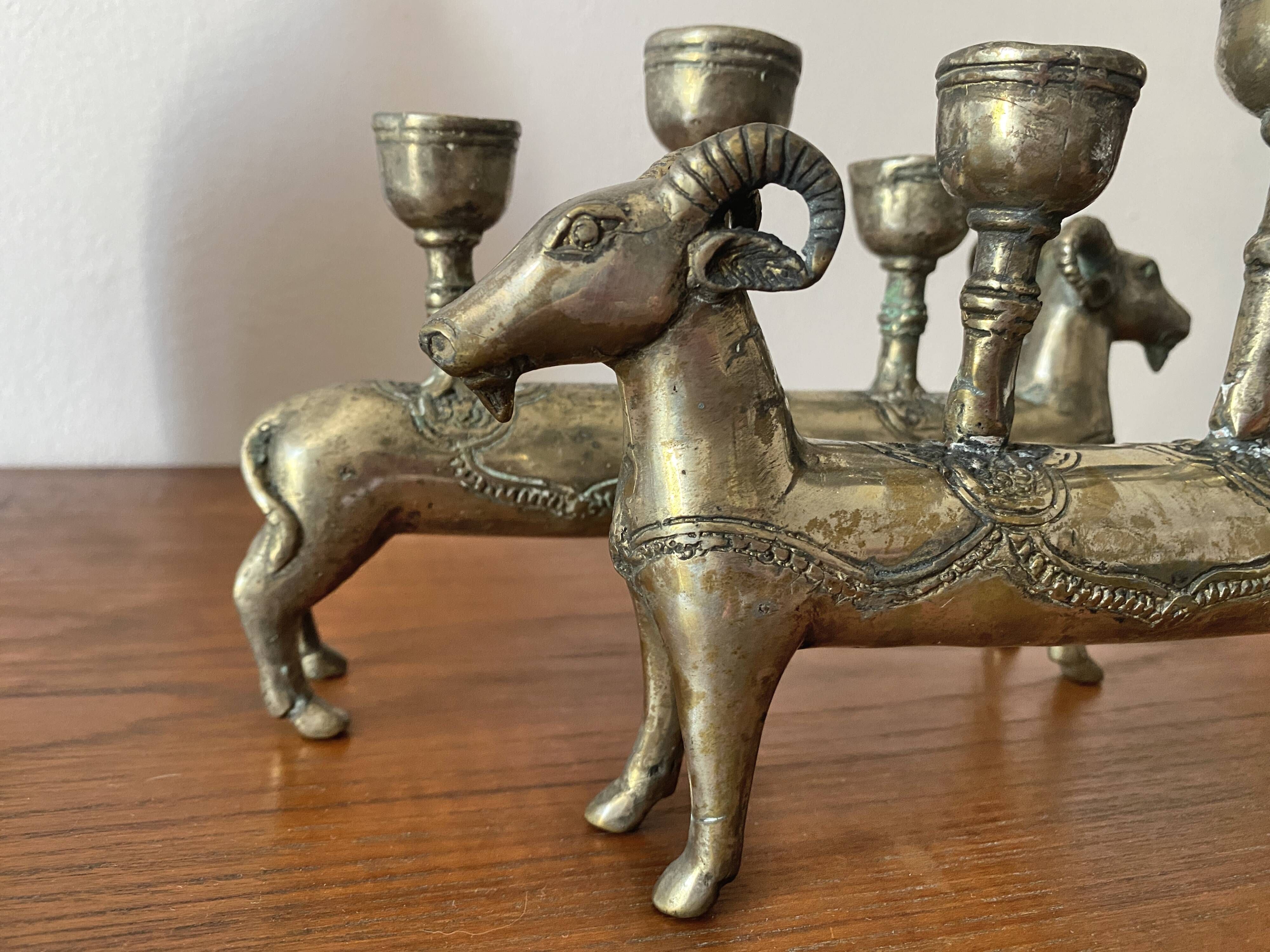 Pair of religious silver-plated zoomorphic candlesticks