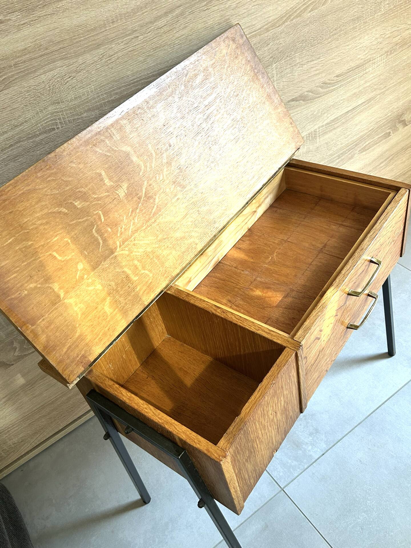 Vintage 1950s sewing machine with blonde oak veneer.