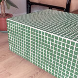 Green mosaic tile table and cream joint