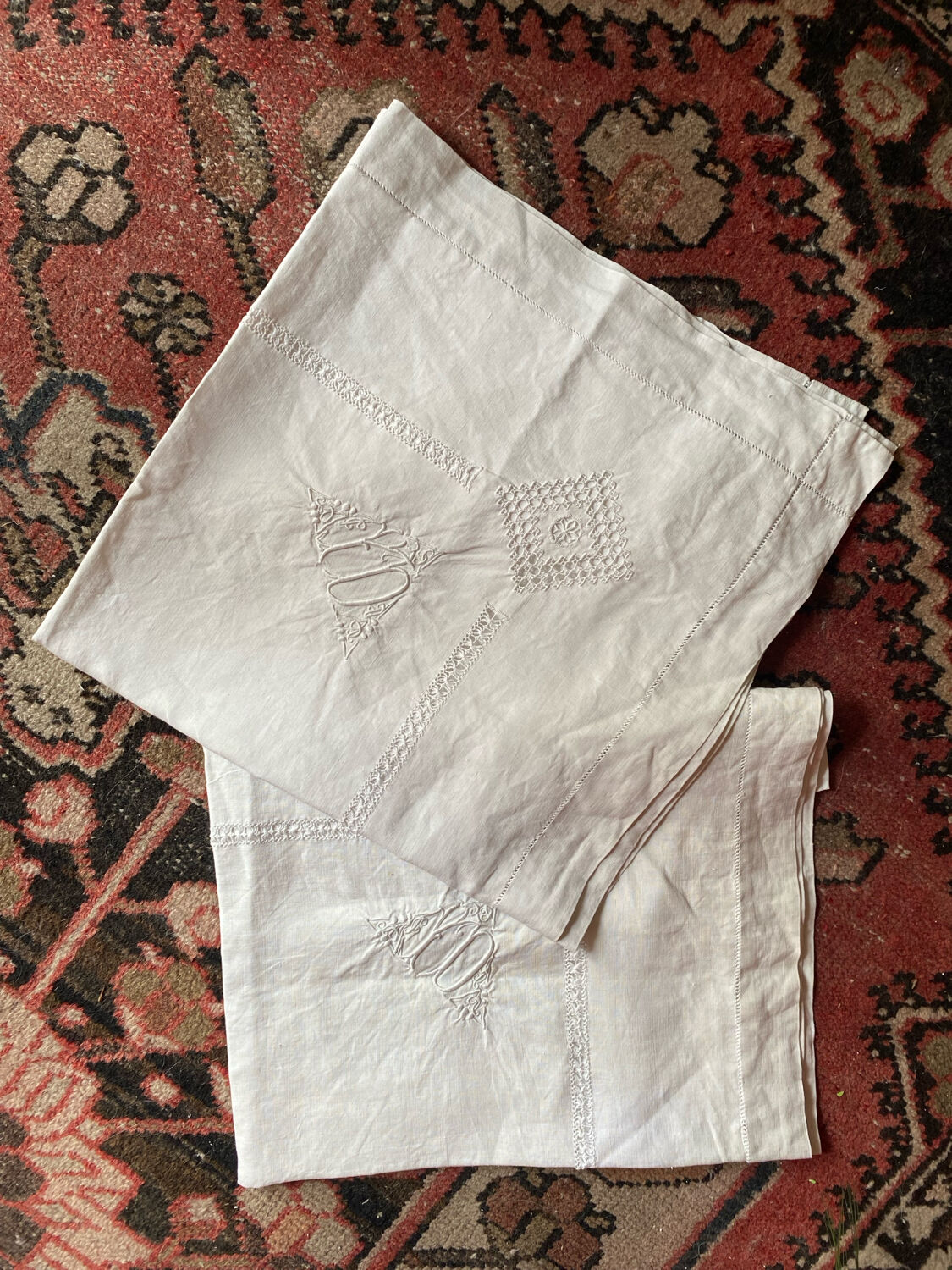 Pair of old cotton embroidered pillowcases with monograms.