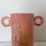 Pink ceramic vase with abstract circular handles