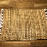 Braided placemats with pompoms